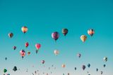 Blue sky full of hot air balloons