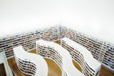 Inside a library; laptop in foreground